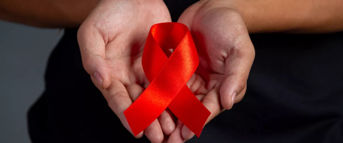 Men holding red ribbons. Conceptual awareness. Hiv. World aids day and world sexual health day.