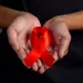 Men holding red ribbons. Conceptual awareness. Hiv. World aids day and world sexual health day.